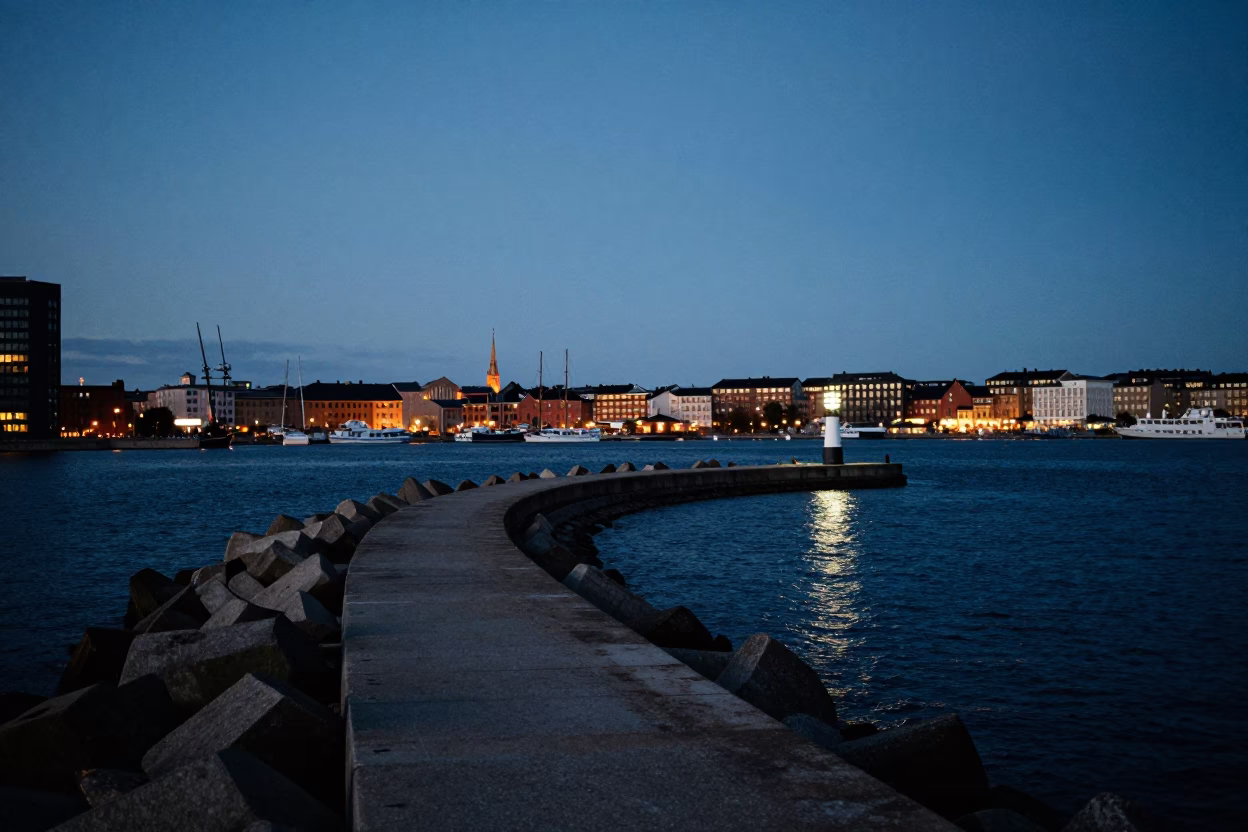 Copenhagen Harbor Breakwater and Beacon at Dusk with City Lights in in Copenhagen, Denmark