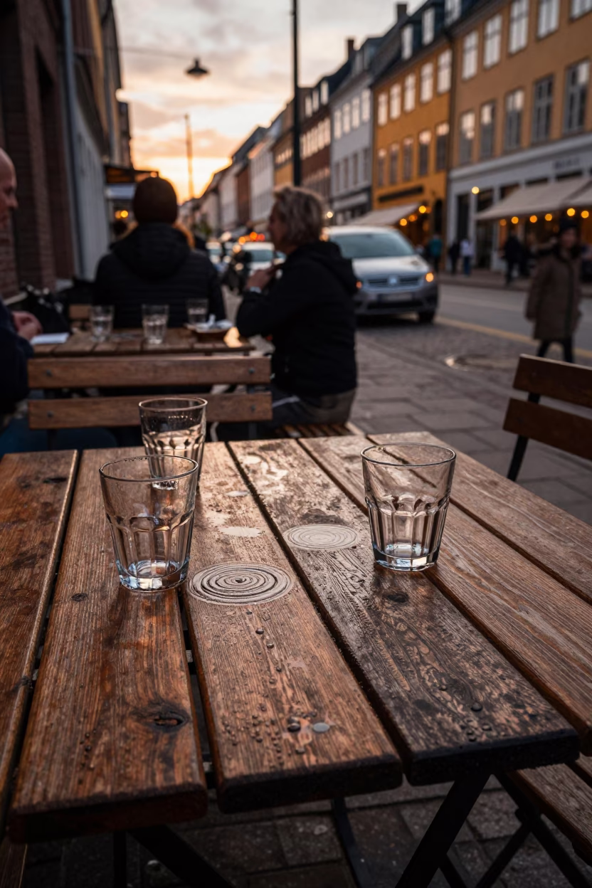 Copenhagen street scene with condensation rings on table before dusk in in Copenhagen, Denmark