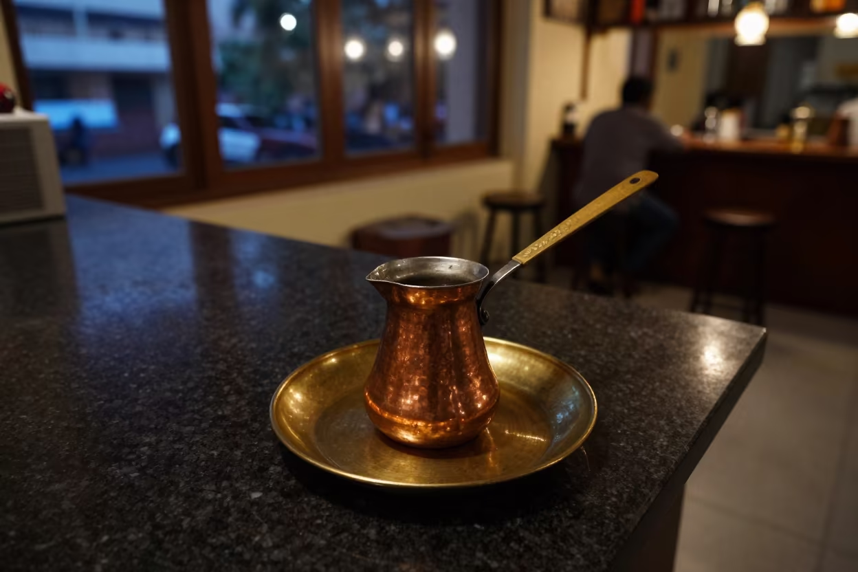 Copper Coffee Pot on Brass Plate Mumbai Counter in at a coffee bar counter in Mumbai