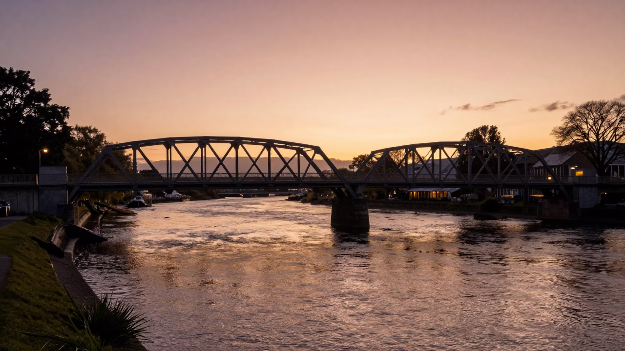 Copper Dusk Over Christchurch Avon River and Iron Bridge Pier in in Christchurch, New Zealand