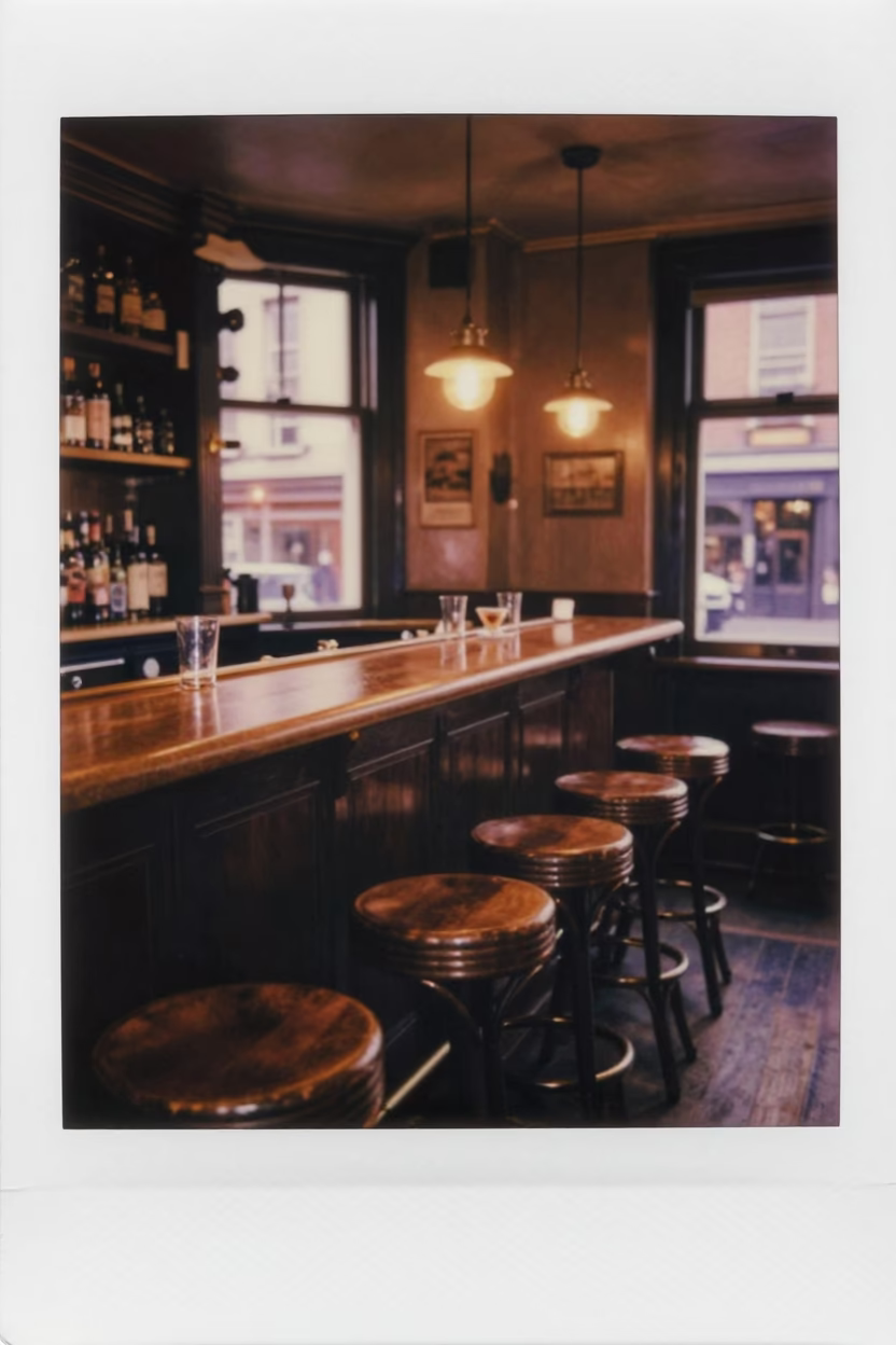 Copper-Toned Dublin Pub Interior with Bar Stools and Tea Kettles Before Dusk in in Dublin, Ireland