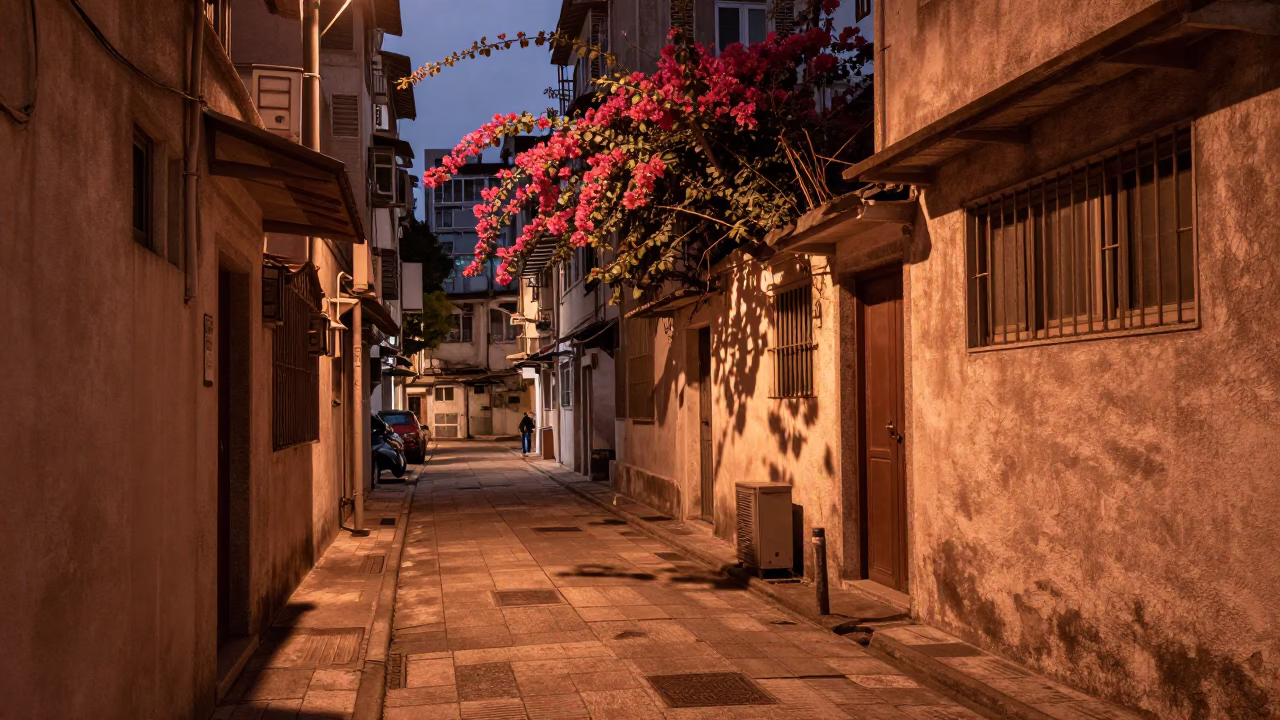 Copper-toned dusk in Hong Kong street with bougainvillea and traditional shaving ritual in in Hong Kong, Hong Kong