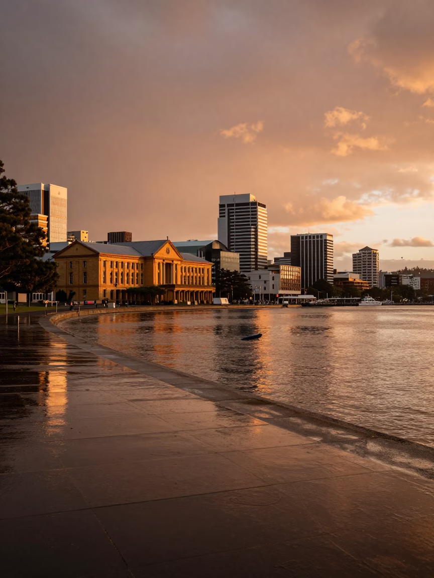 Copper Toned Dusk Light Over Hobart Waterfront With University Cloister and Wet Flagstones in in Hobart, Tasmania, Australia