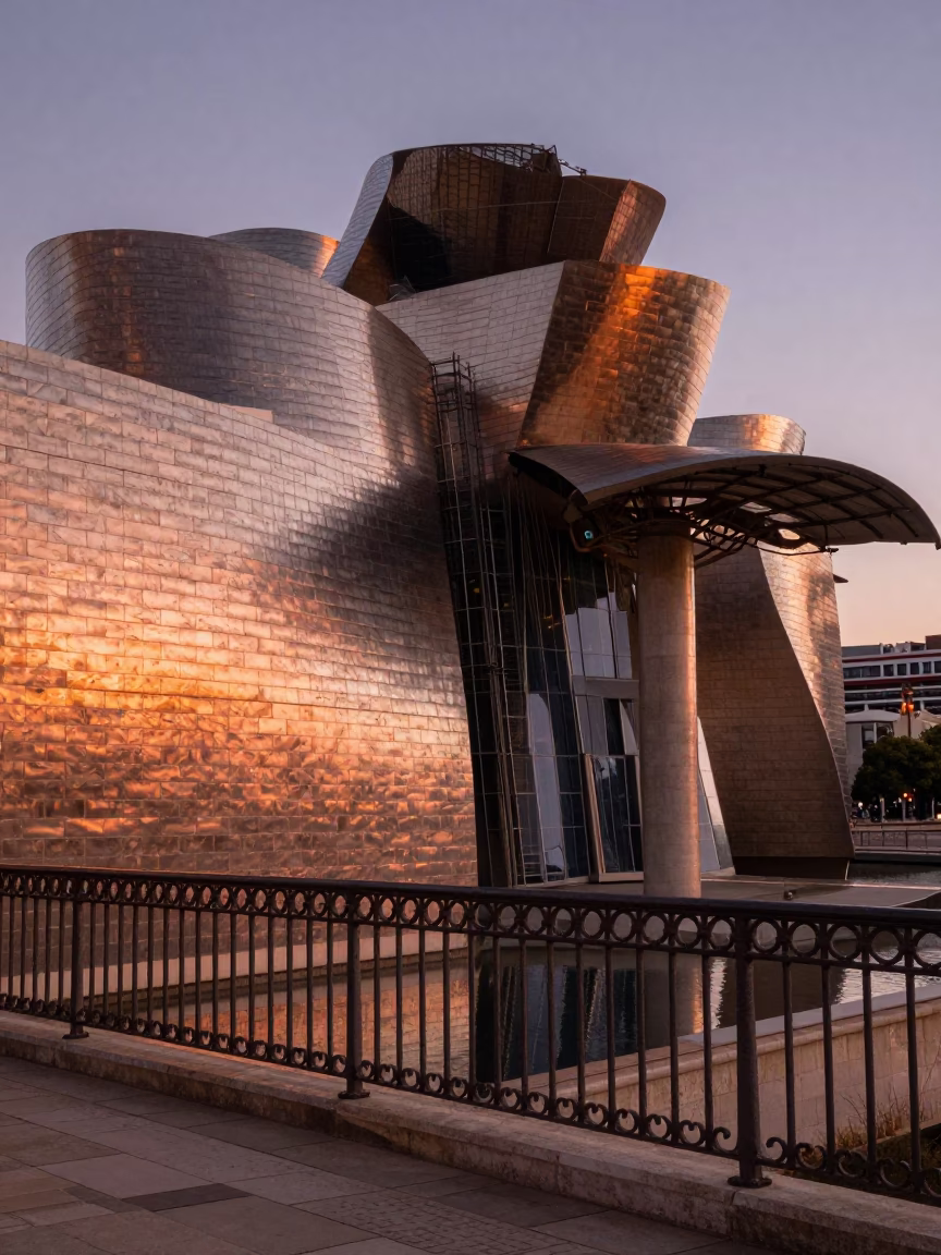 Copper-toned dusk light reflecting off Bilbao stone architecture and street details in in Bilbao, Spain