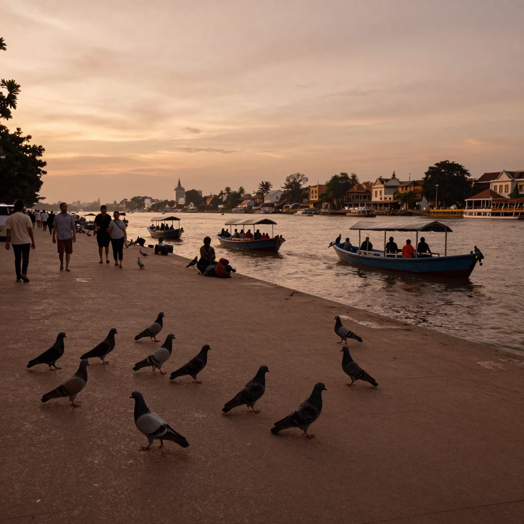 Copper-toned dusk scene in Phnom Penh with pigeons and river traffic in in Phnom Penh, Cambodia