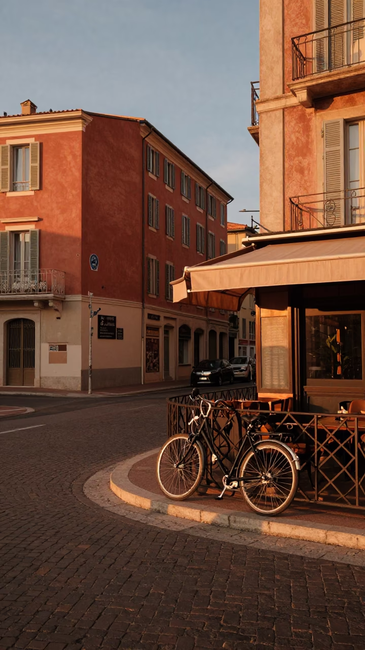 Copper-toned dusk street scene in Nice France with bicycle and café in in Nice, France
