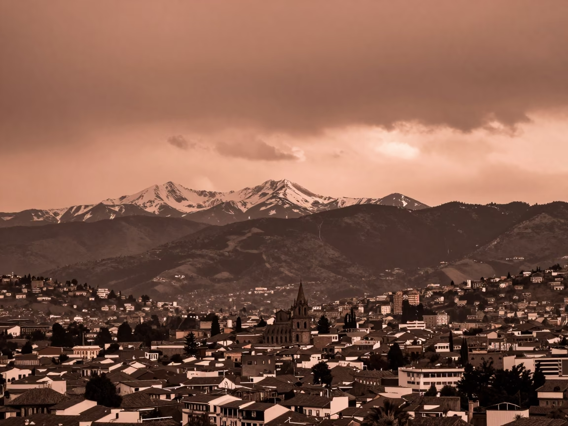 Copper-toned Dusk View of Quito Ecuador Andes Mountains and Colonial Architecture in in Quito, Ecuador
