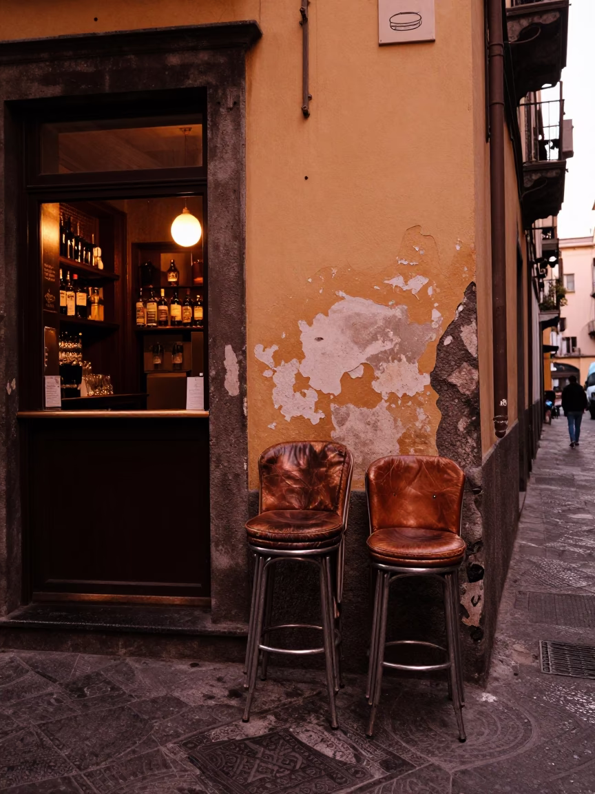 Copper Toned Naples Street Scene Before Dusk with Bar Stools and Local Interaction in in Naples, Italy