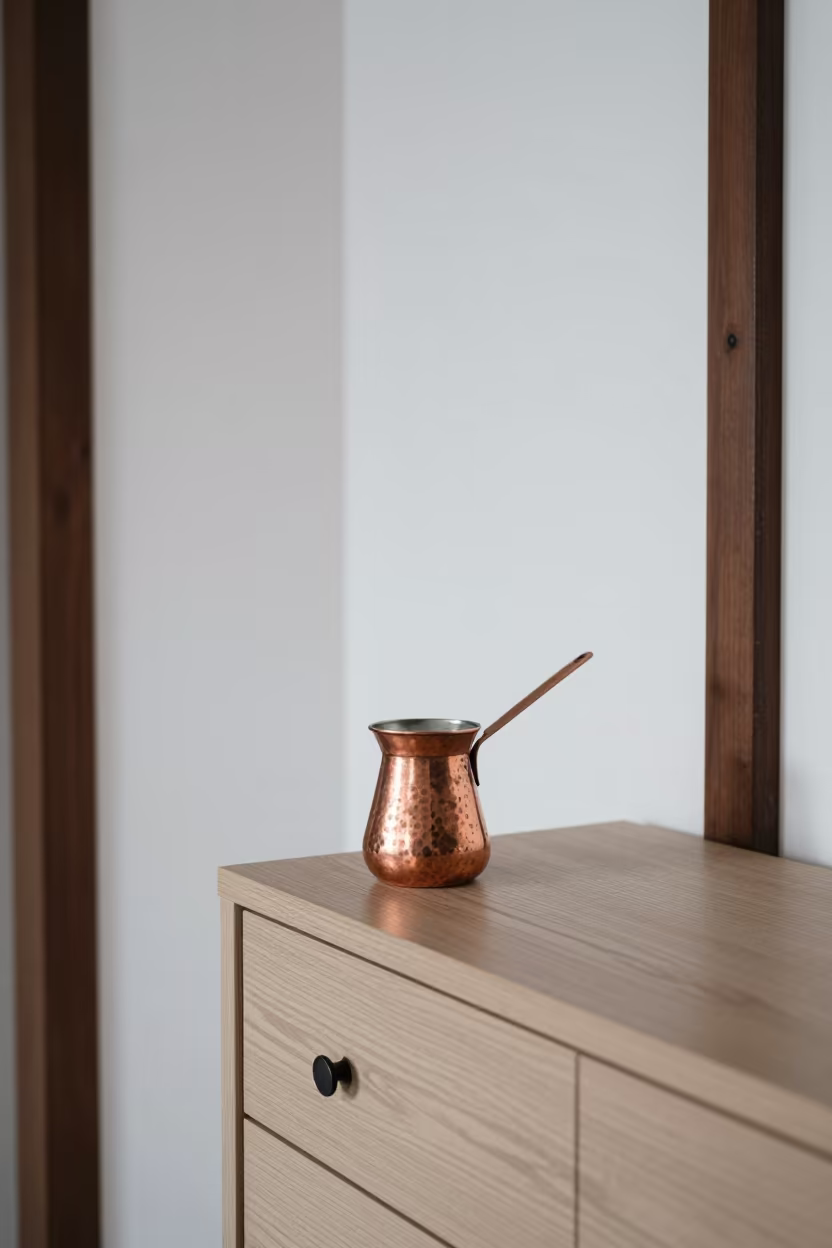 Copper Turkish Mocha Pot on Hotel Dresser in on a hotel dresser in Mogadishu