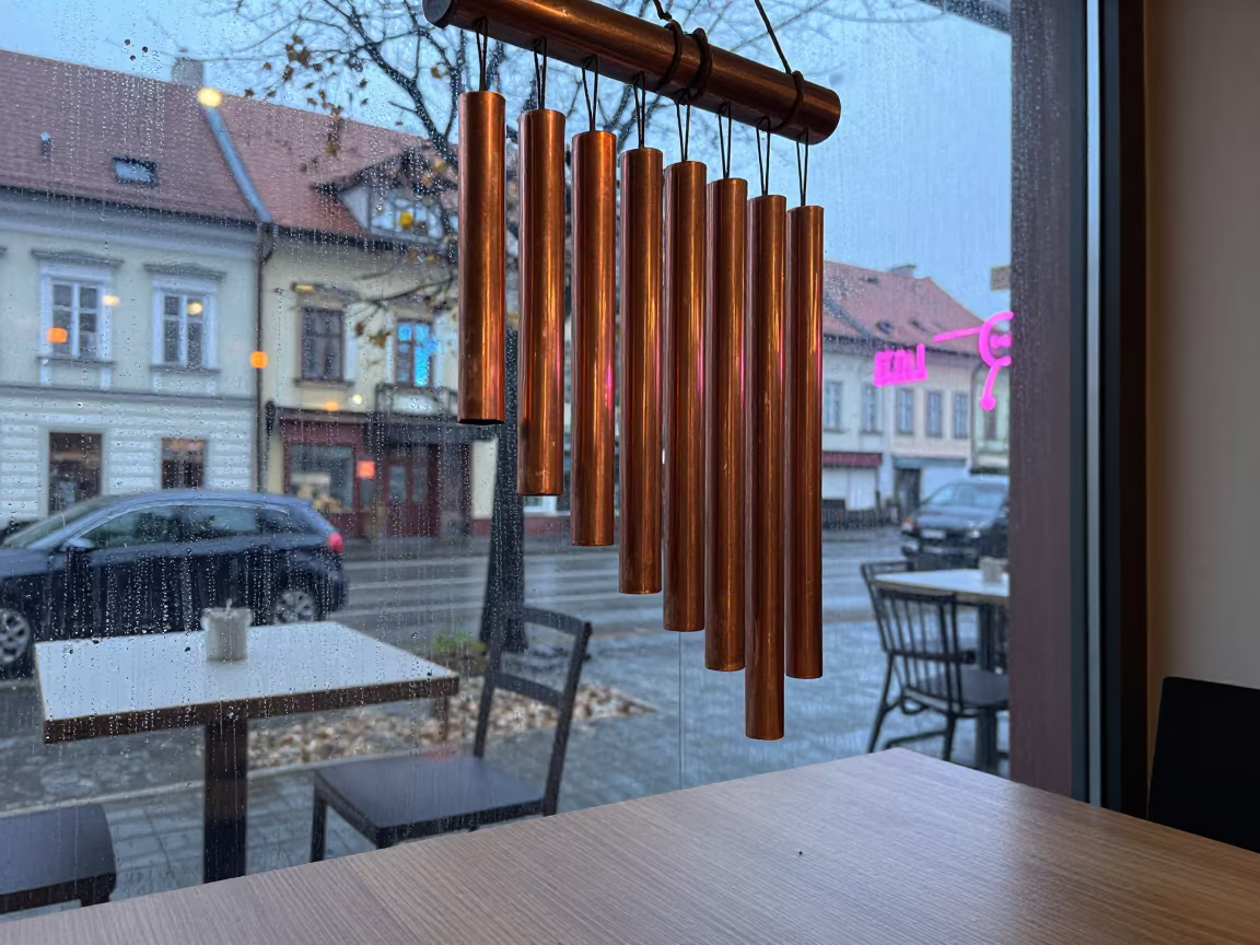 Copper Wind Chime Neon Cafe Window in on a cafe table by a window in Chorzów