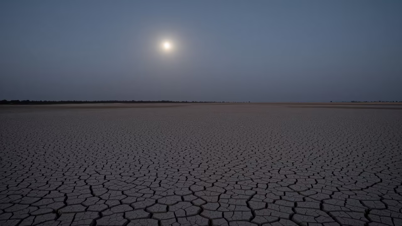 Cracked Mud in Predawn Moonlight Near Helwan in across a floodplain after rain near Helwan