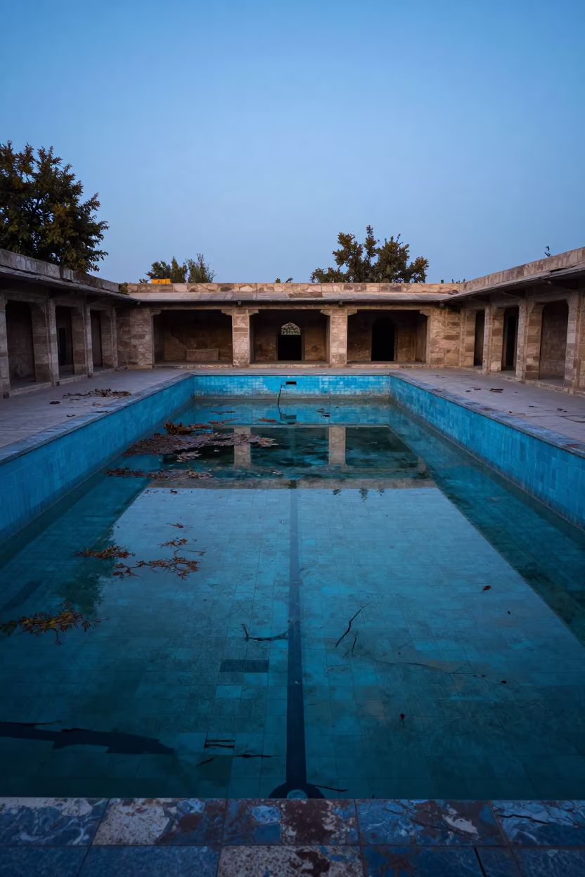 Cracked Tiles and Stagnant Water in Rawalpindi Ruins in among roofless stone chambers near Rawalpindi