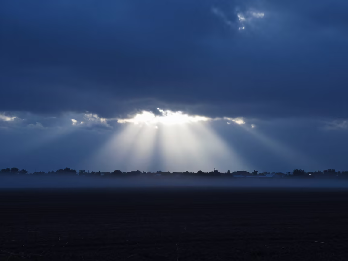 Crepuscular Rays Over Valencia Storm Plain in across a storm-bright plain in Valencia