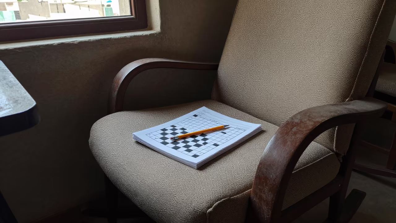 Crossword and Pencil in Sanaa Porch Chair in on a porch with a rocking chair in Sanaa