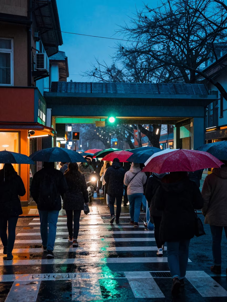 Crowded Umbrellas Under Flickering Light in beneath a flickering underpass light in Bago