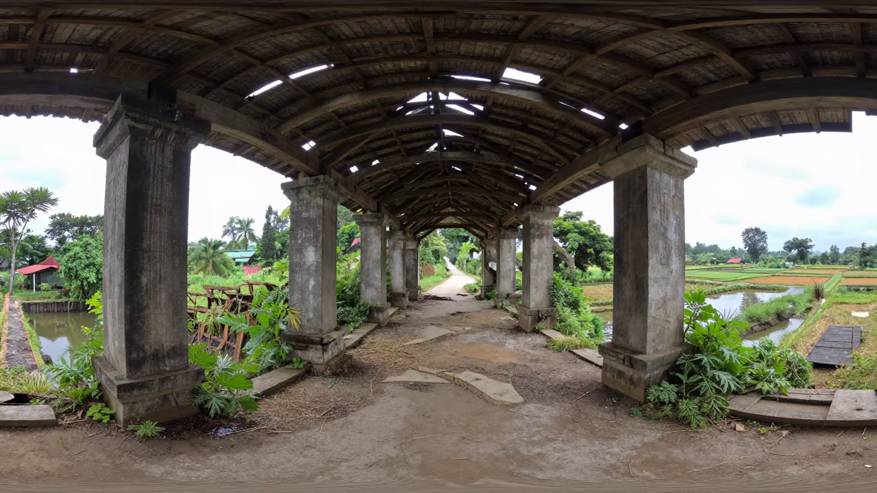 Crumbled Covered Bridge Amidst Indonesian Ruins in among toppled columns and nettles in Indonesia
