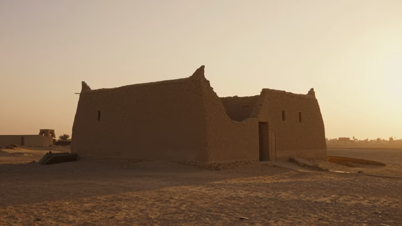 Crumbling Adobe House Melting into Desert Floor in inside a roofless nave near Cairo
