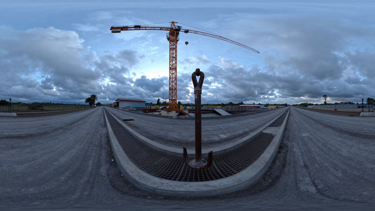 Curbed Inlet Grate Hook Stand Under Crane in beneath a tower crane on open ground in Papua New Guinea