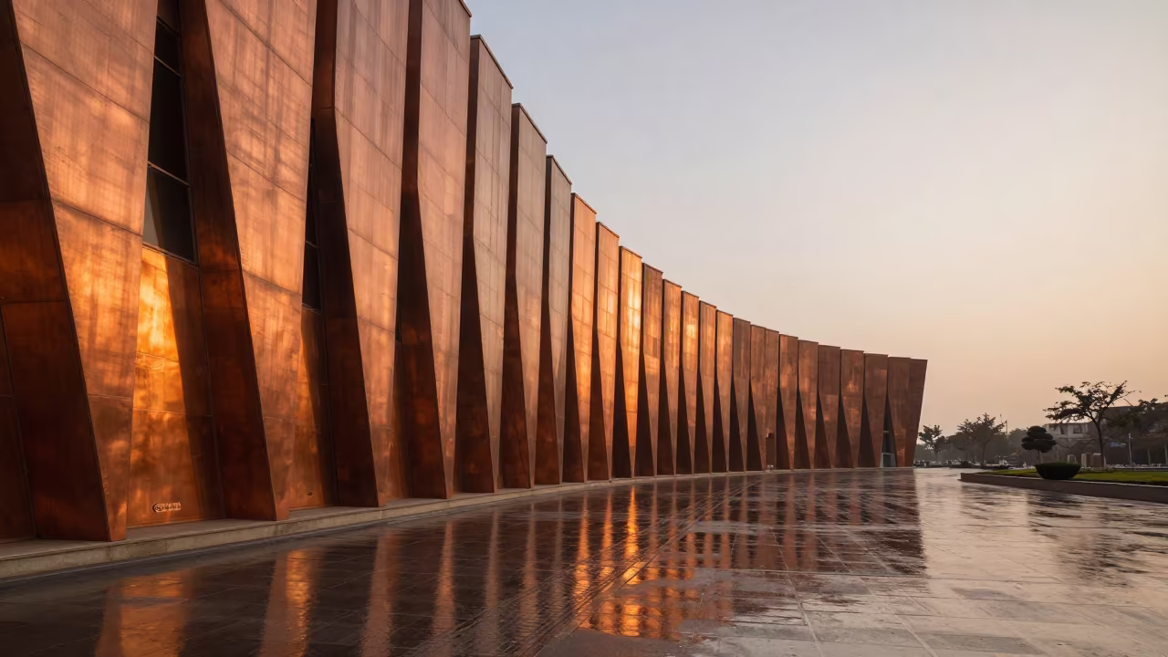 Curved Museum Facade in Amber Winter Light in across a formal civic plaza near Dera Ismail Khan