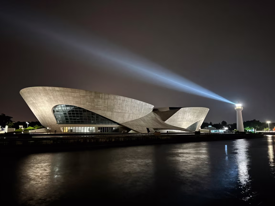 Curved Museum Facade by Canal at Night in beside a canal-front facade in Riverside, Phnom Penh