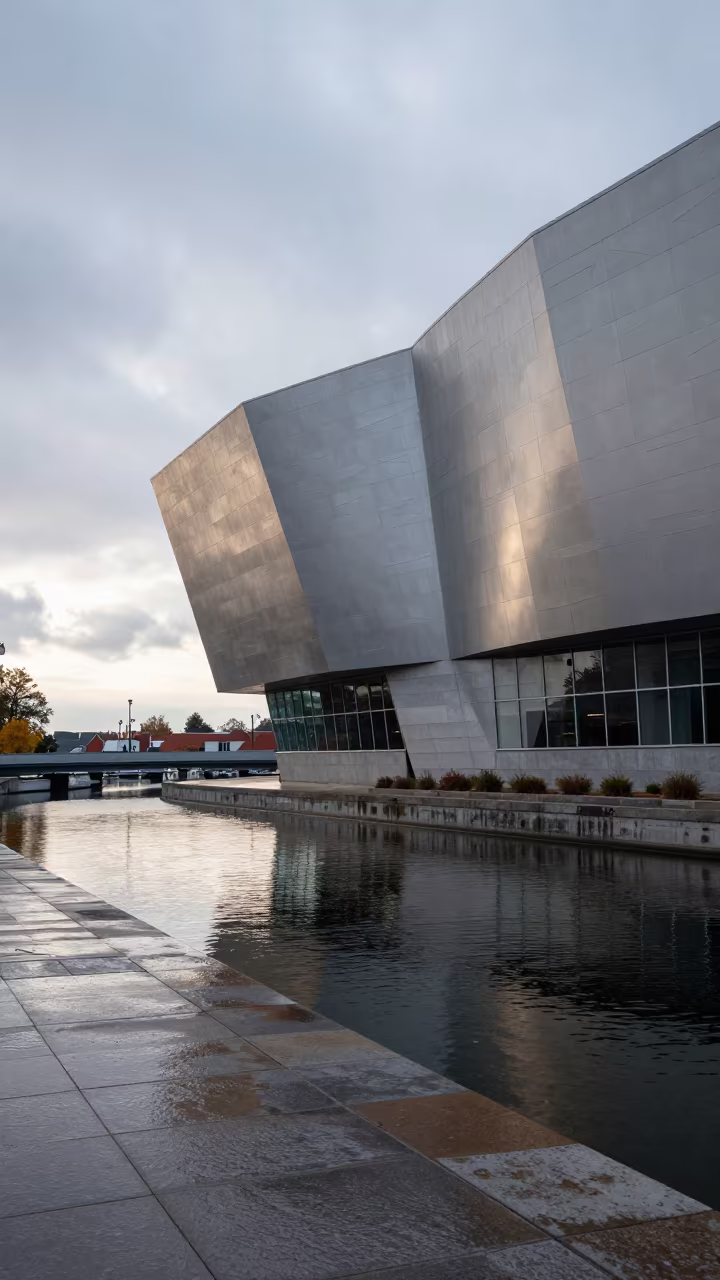 Curved Museum Facade at Dawn in beside a canal-front facade in Canada