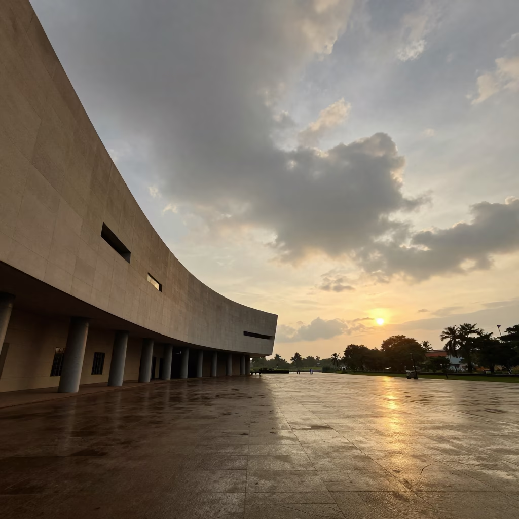 Curved Museum Facade Golden Hour Odisha in across a formal civic plaza in Odisha