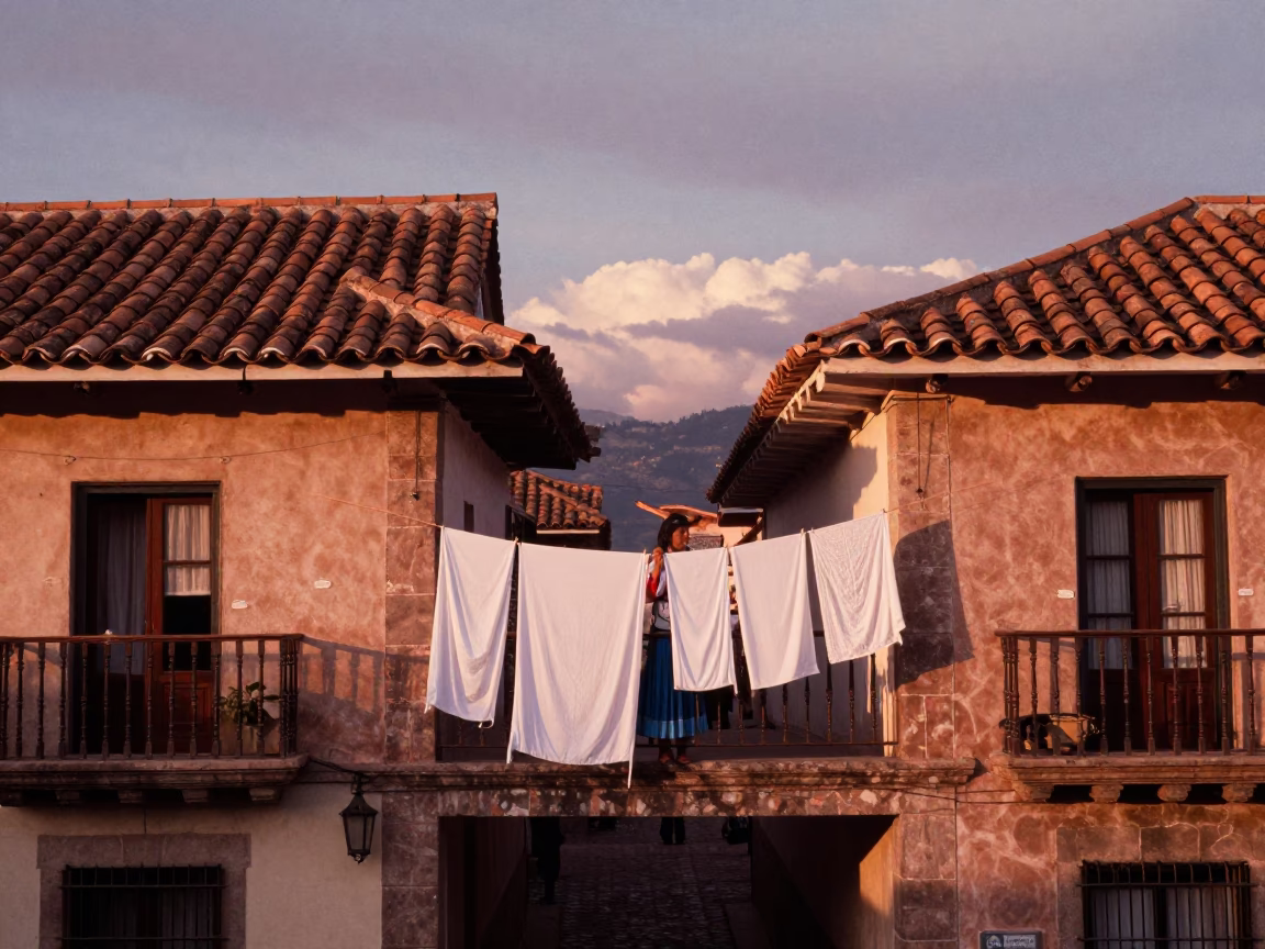 Cusco Peru Before Dusk Woman Hanging Laundry Between Colonial Apartment Buildings in in Cusco, Peru