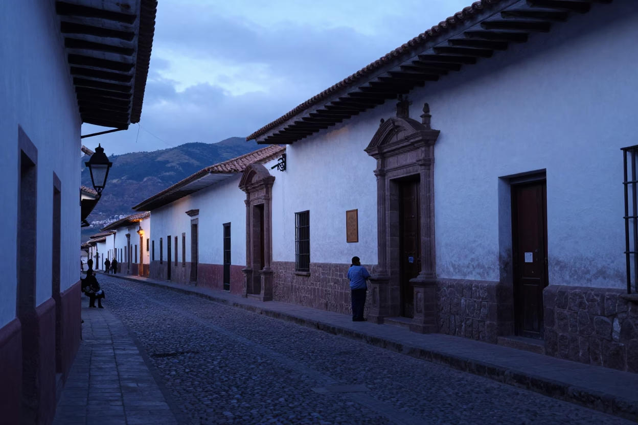 Cusco Peru street scene at dawn with colonial architecture and local vendor in in Cusco, Peru