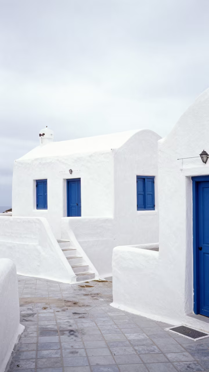 Cycladic Whitewashed House Blue Shutters Kitale Stair Hall in inside a tiled stair hall in Kitale