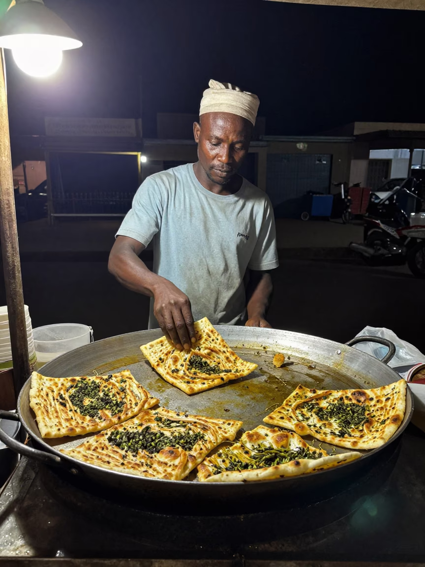 Dakar Cooking Manakeesh at Deep In The Night Light in in Dakar, Senegal