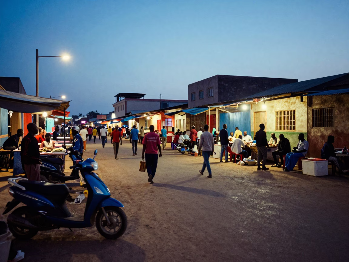 Dakar Senegal Blue Hour Street Scene with Scooter and Local Market Life in in Dakar, Senegal