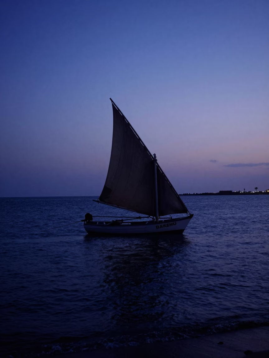 Dakar Senegal Predawn Coastline Silhouetted Dhow Sailboat Harbor Scene in in Dakar, Senegal