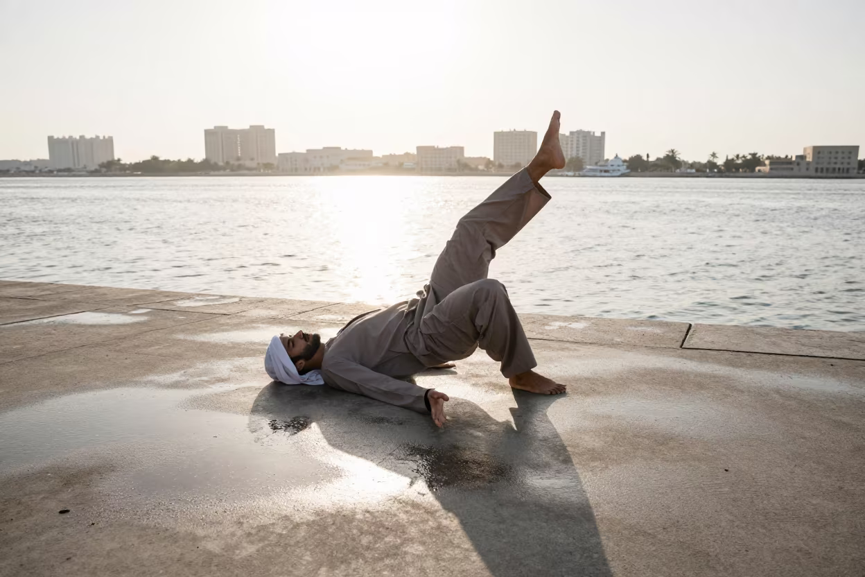 Dancer Resting Under Dual Suns in Winter Ajman in near a riverside landing in Ajman