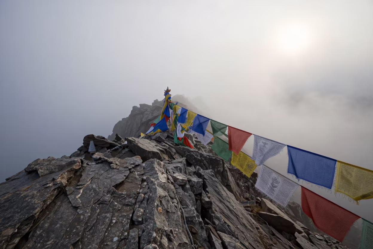Dawn Cap Cloud on Kathmandu Mountain Ridge in on a wind-cut ridge below prayer flag lines near Kathmandu