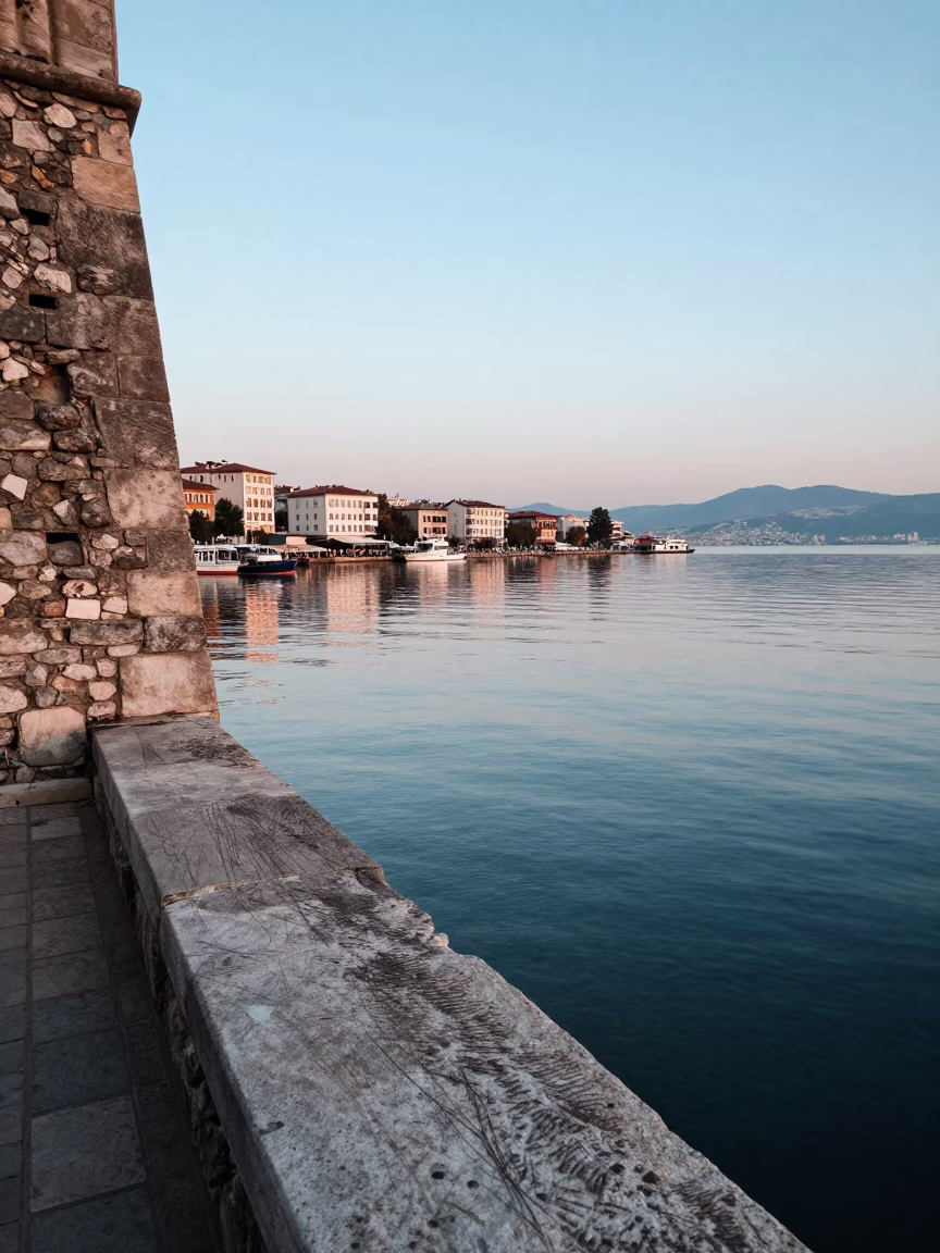 Dawn Harbor Scene in Izmir Turkey with Reflections and Old Walls in in Izmir, Turkey