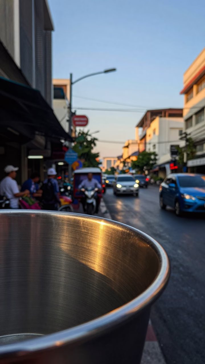 Dawn in Bangkok Thailand Street Scene with Brushed Steel Cup Rim and Morning Activity in in Bangkok, Thailand