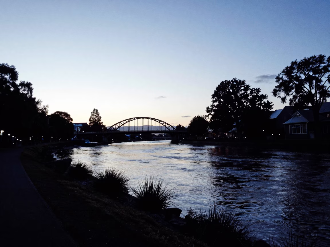 Dawn in Christchurch New Zealand Riverbank and Bridge Silhouette in in Christchurch, New Zealand