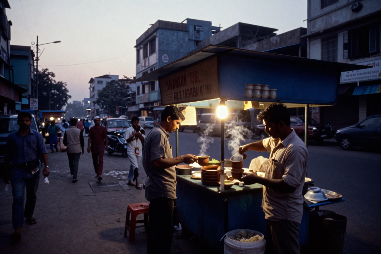 Dawn in Kolkata India Street Scene with Tea Stall and Morning Commuters in in Kolkata, India