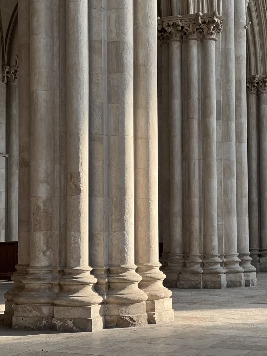 Dawn Light on Limestone Columns in Genoa Cathedral in inside a stone chapel in Genoa