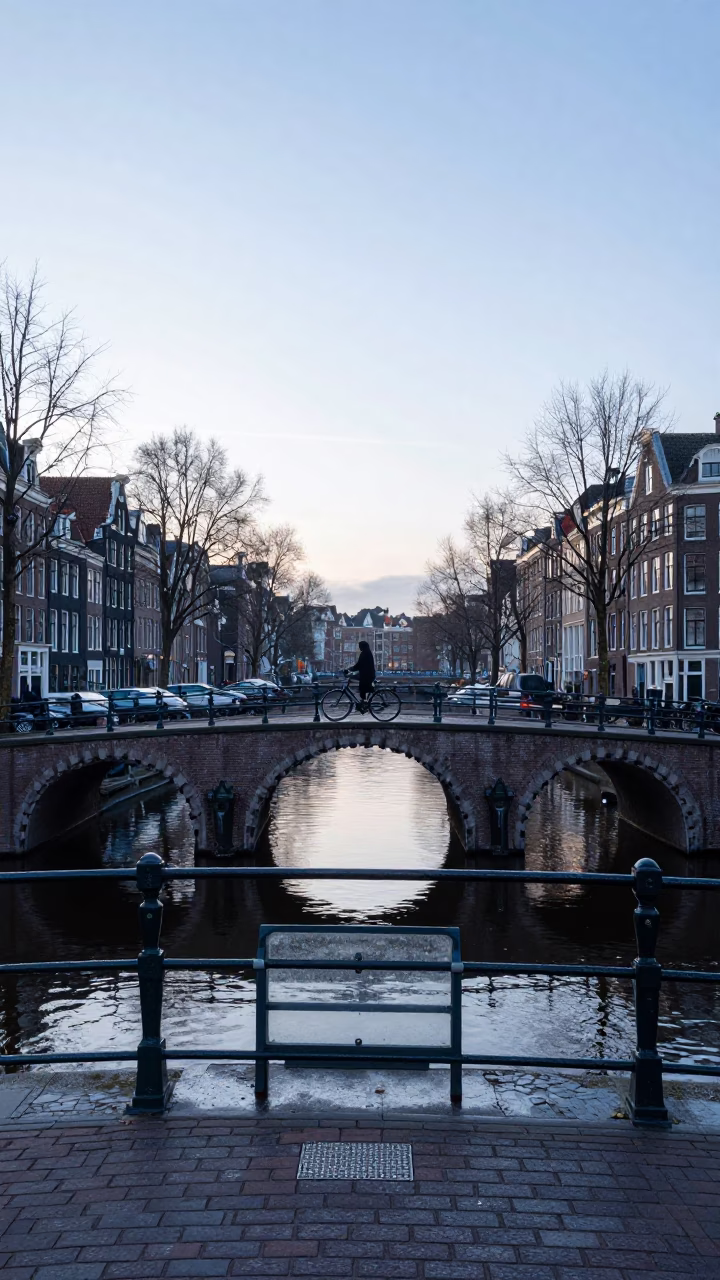 Dawn Light on Amsterdam Canal Bridge with Glass Latch and Morning Mist in in Amsterdam, Netherlands