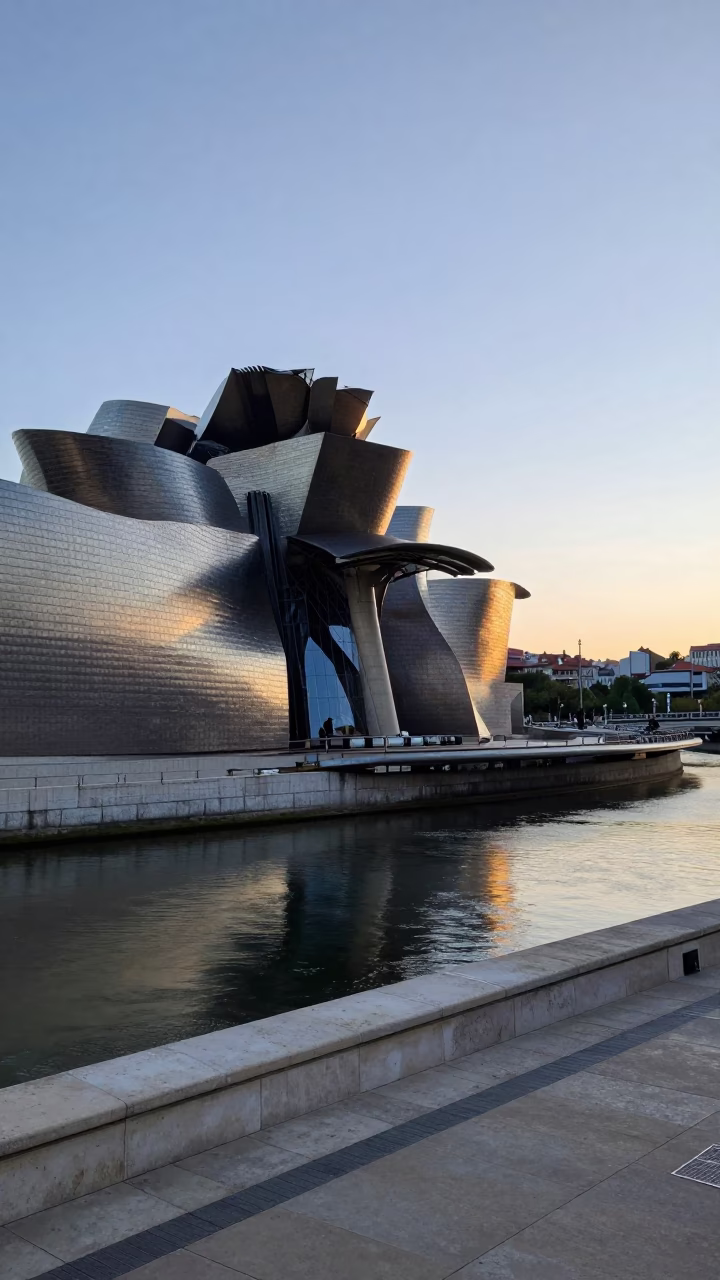 Dawn Light on Bilbao's Guggenheim Exterior and Nervion River Promenade in in Bilbao, Spain