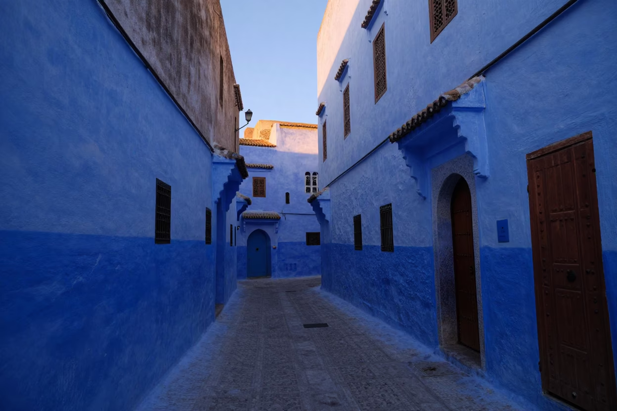 Dawn Light on Blue Washed Walls and Wooden Shutters in Historic Essaouira Medina Morocco in in Essaouira, Morocco