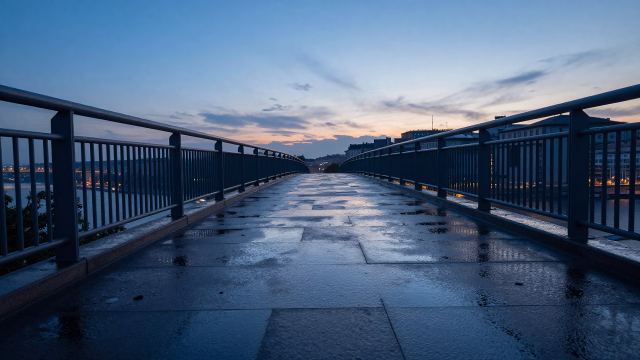 Dawn light on Budapest pedestrian overpass with wet footsteps and perforated metal railing in in Budapest, Hungary