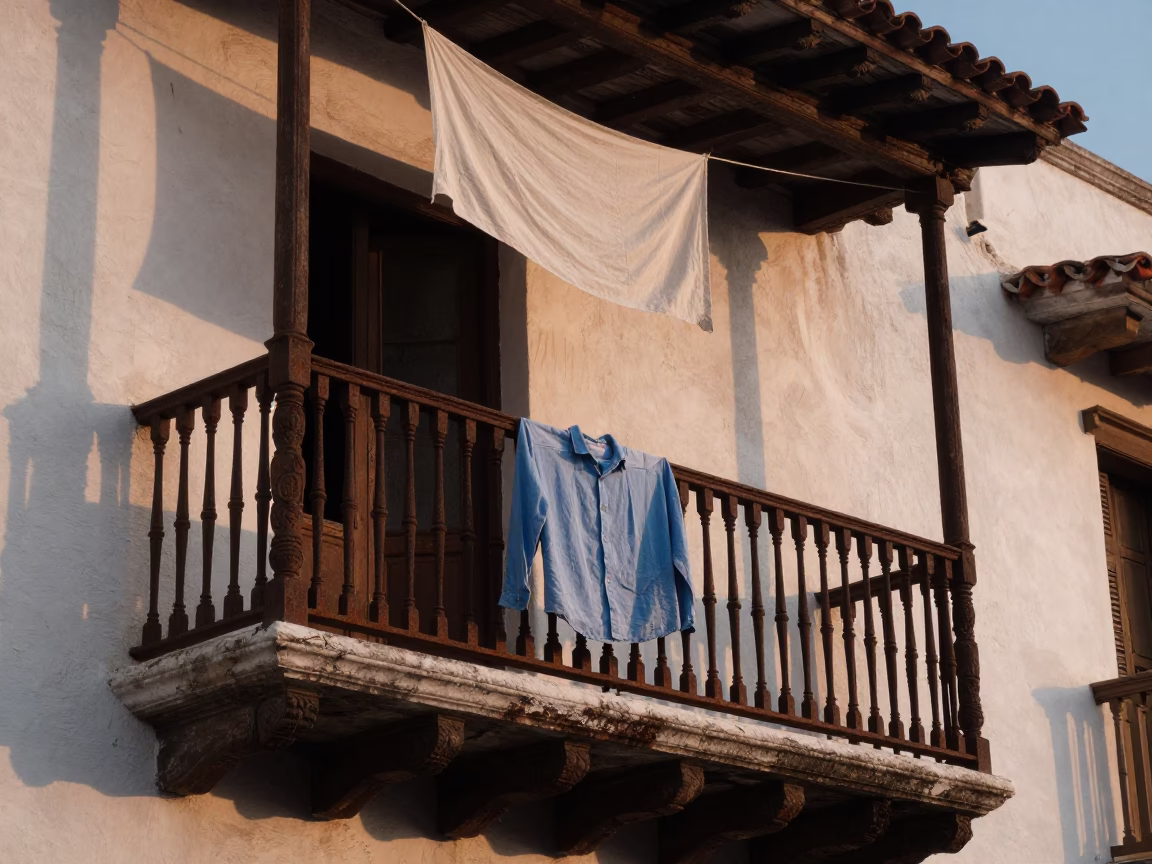 Dawn Light on Colonial Balcony in Cartagena Colombia with Hanging Linen and Street View in in Cartagena, Colombia