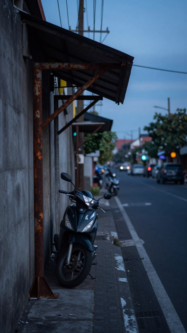 Dawn Light on Denpasar Street with Rusting Metal and Local Morning Routine in in Denpasar, Indonesia