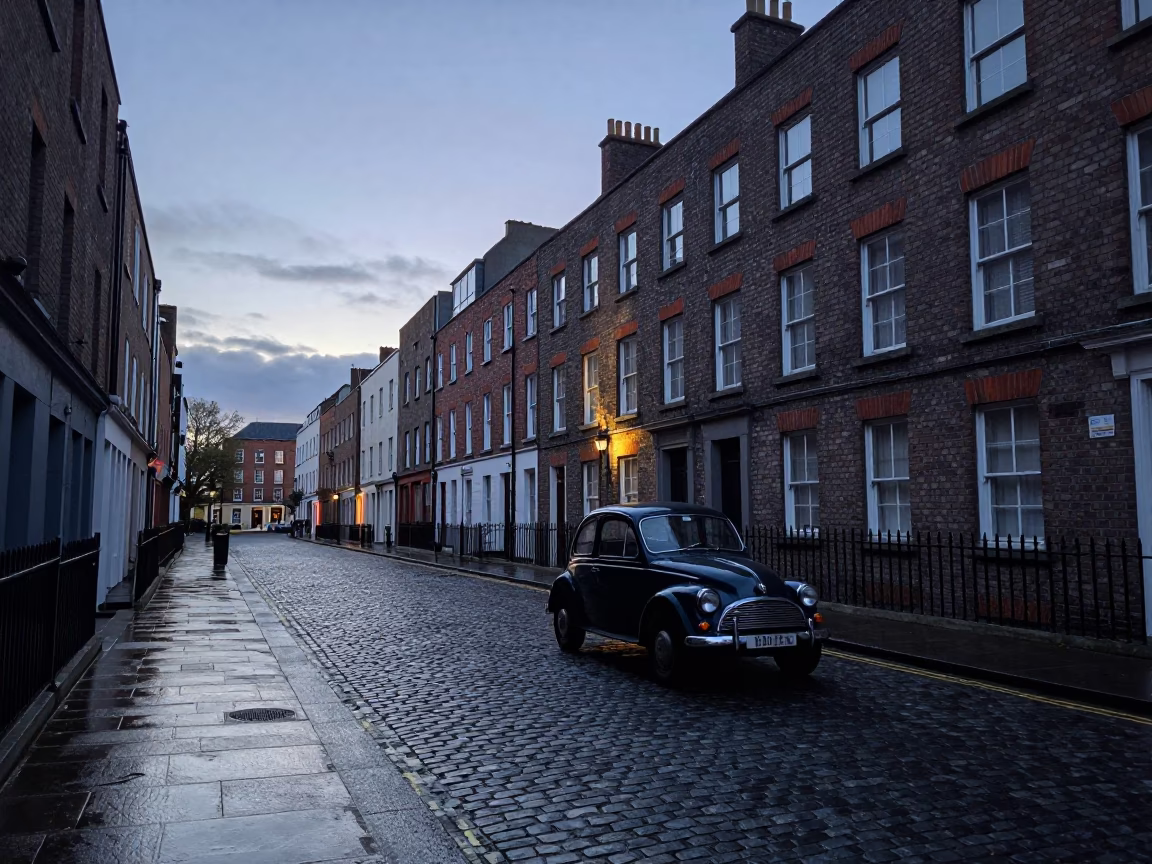 Dawn Light on Dublin Cobblestone Street with Vintage Car and Local Pedestrians in in Dublin, Ireland