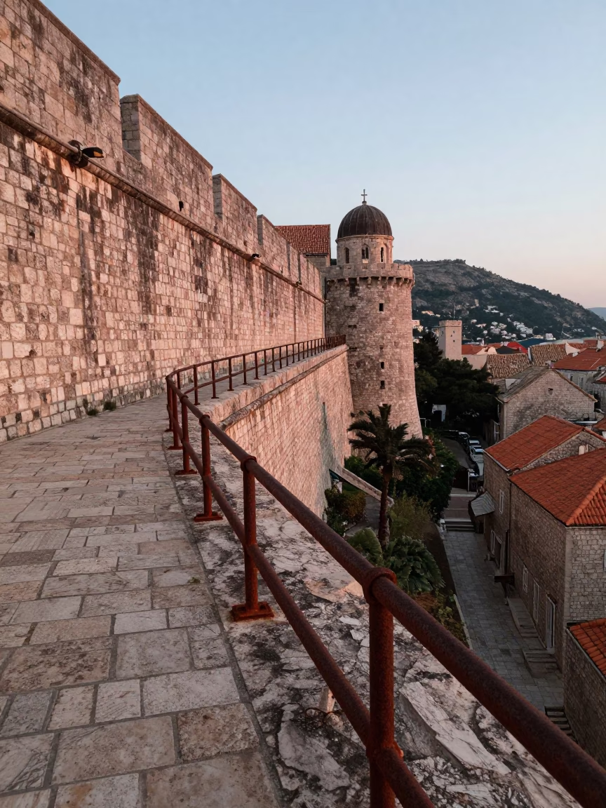 Dawn Light on Dubrovnik Stone Walls with Rusty Rail and Porcelain Jar in in Dubrovnik, Croatia