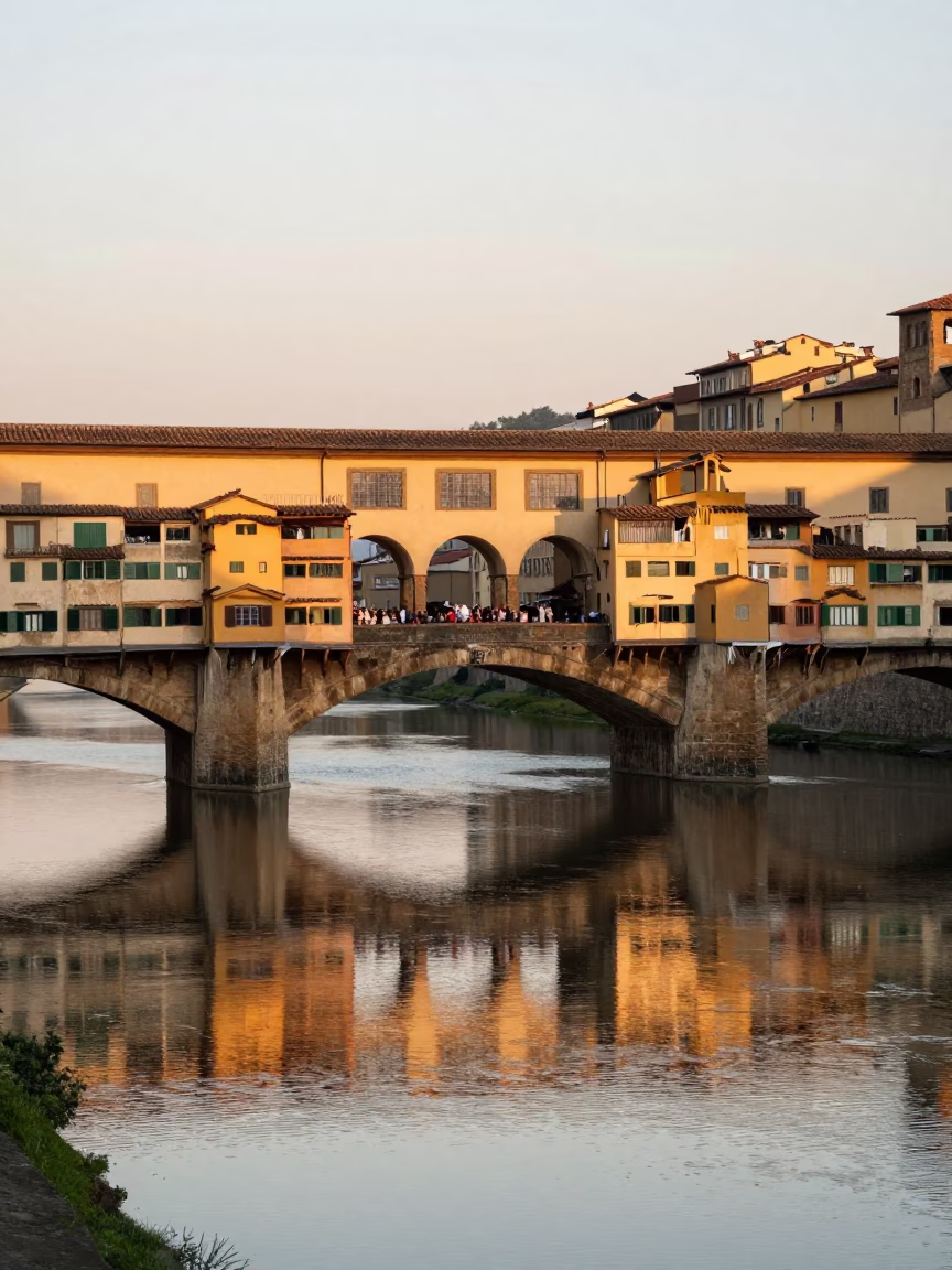 Dawn light on Florence Ponte Vecchio with artisan leatherwork and historic stone bridges in in Florence, Italy