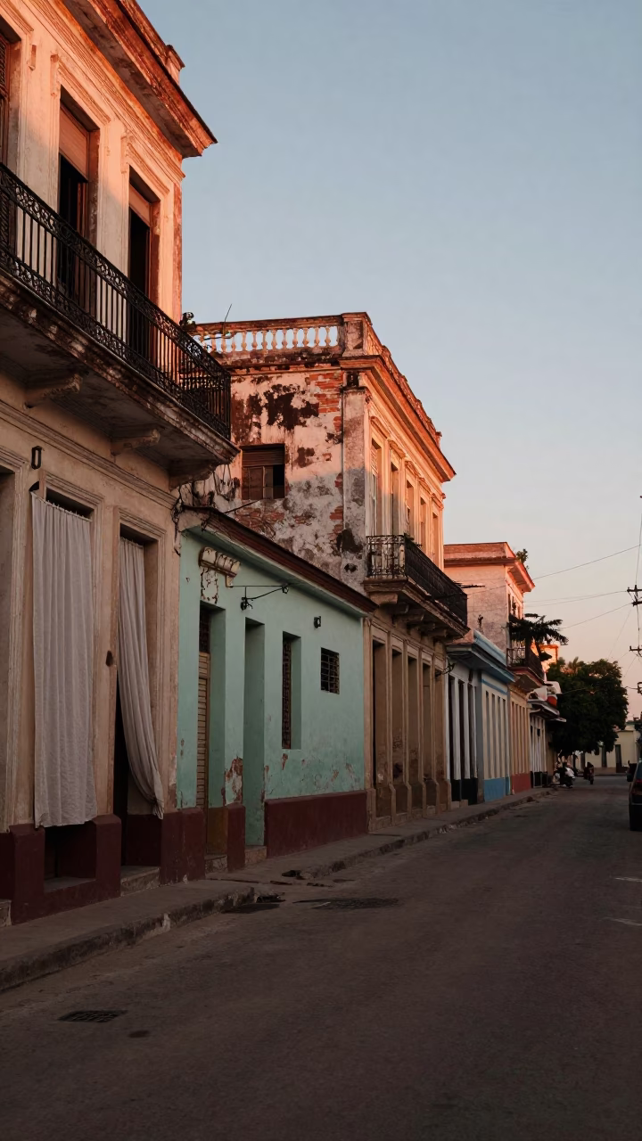 Dawn light on Havana street with linen curtains and local morning routine in in Havana, Cuba