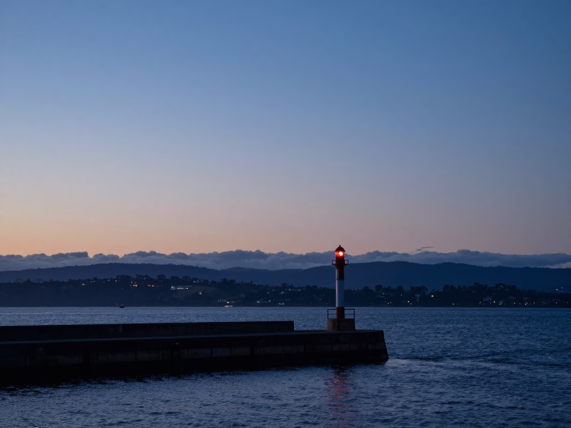 Dawn Light on Hobart Breakwater With Warning Beacons and Coastal Stacks in in Hobart, Tasmania, Australia